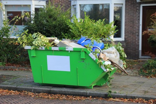 Low-emission van loading garden waste in Brockley street